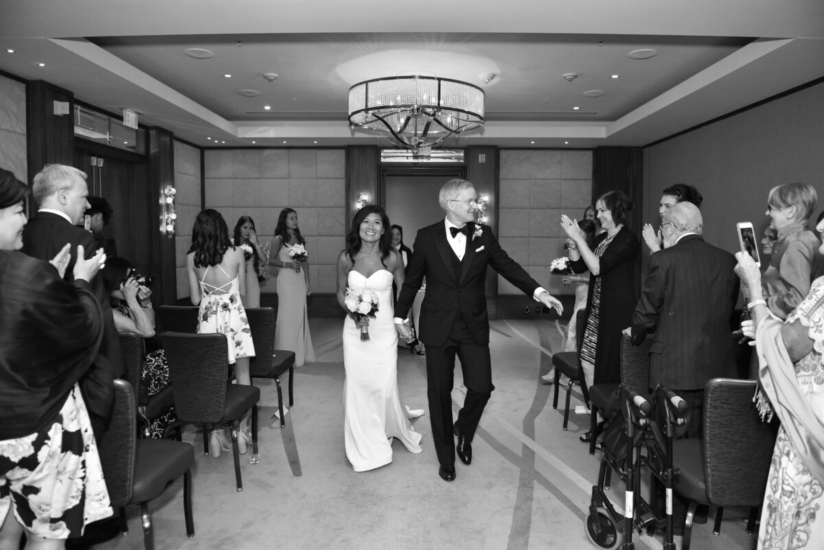 bride-groom-walking-down-aisle-married