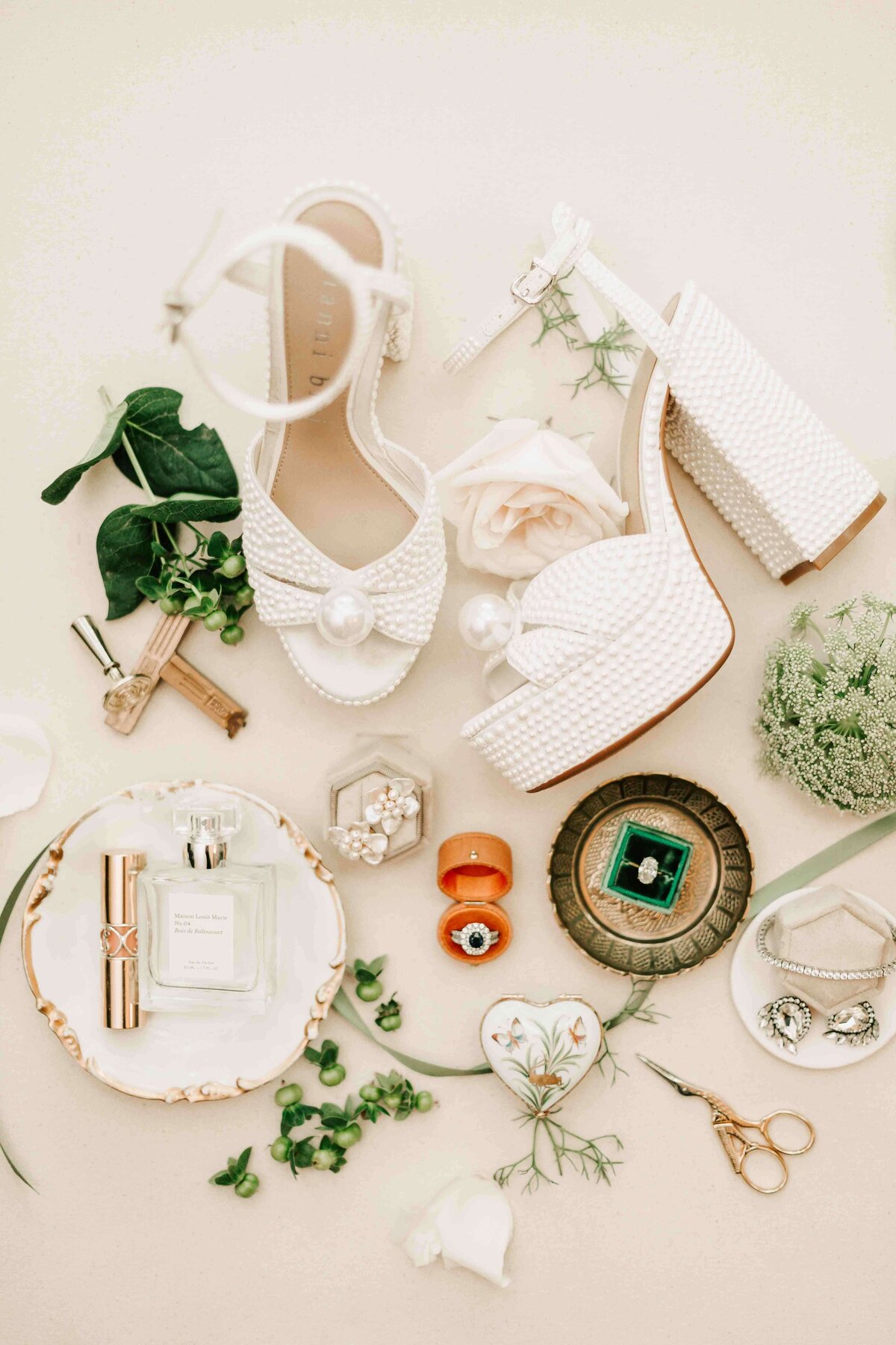 flat lay of details of a brides wedding day.
