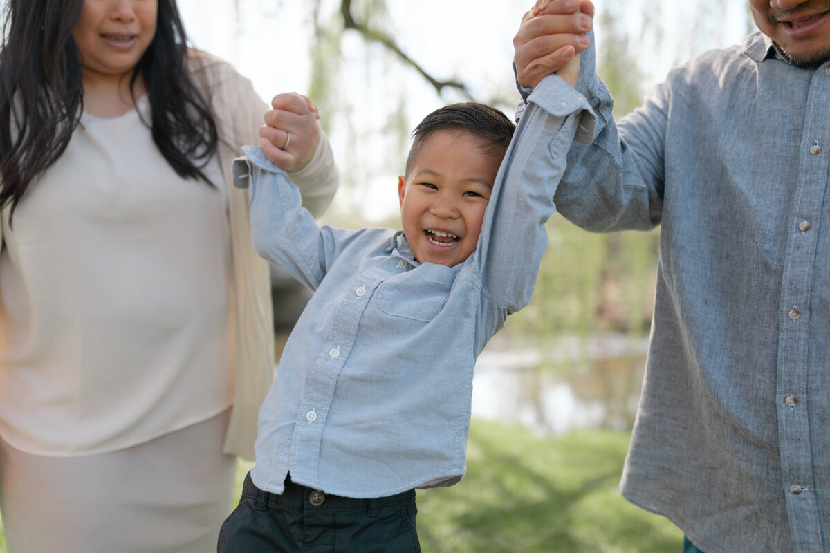 family holding hands in park