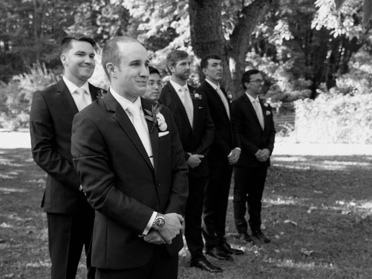 Outdoor wedding ceremony under clear blue sky.