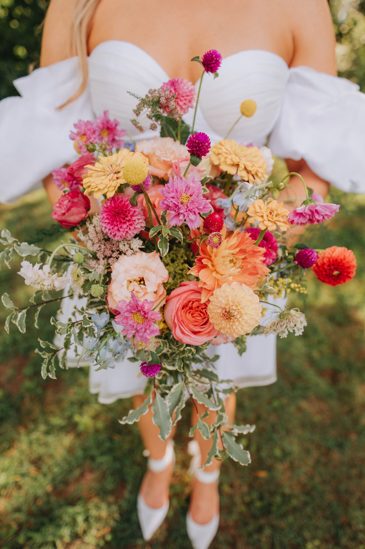A person holds colorful florals