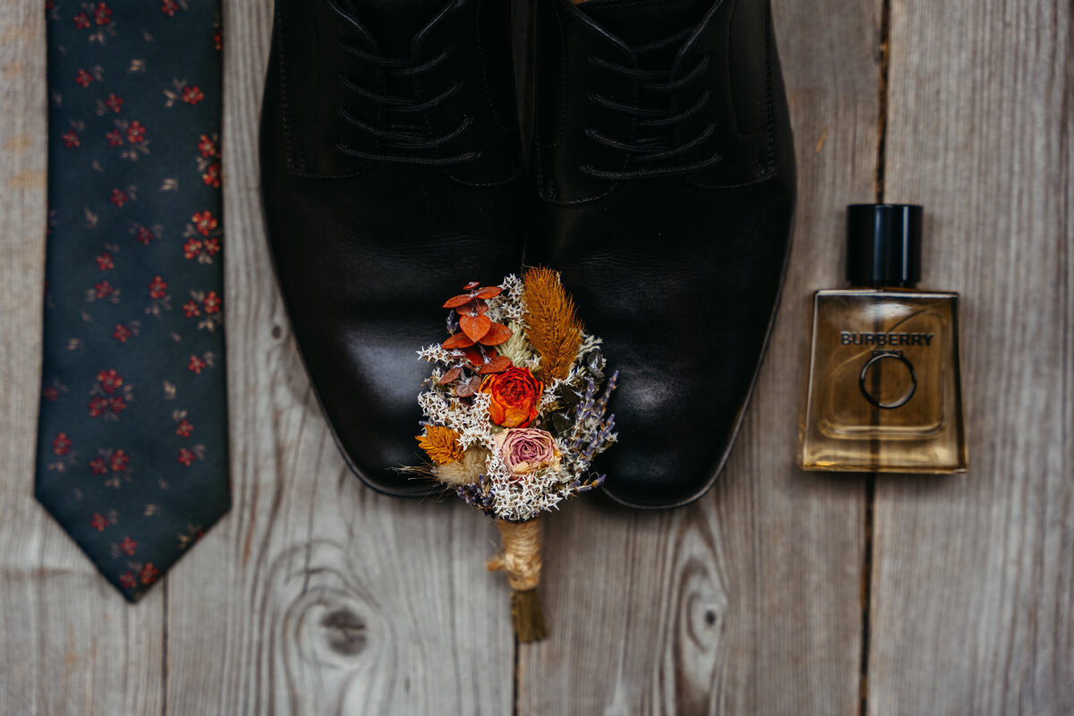 Flatlay with stationery, ribbons, and sentimental Dolomites elopement details