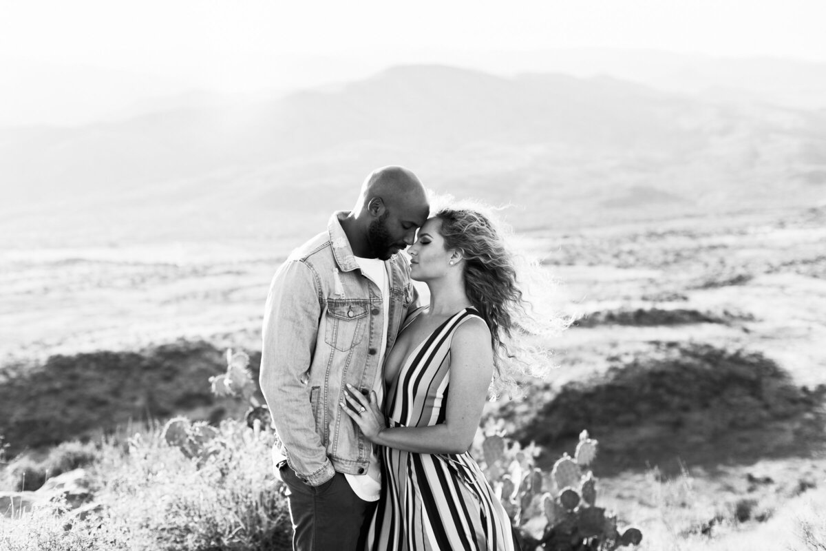 engaged couple posing together for engagement photo