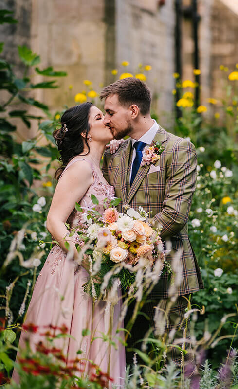 Married kiss in garden