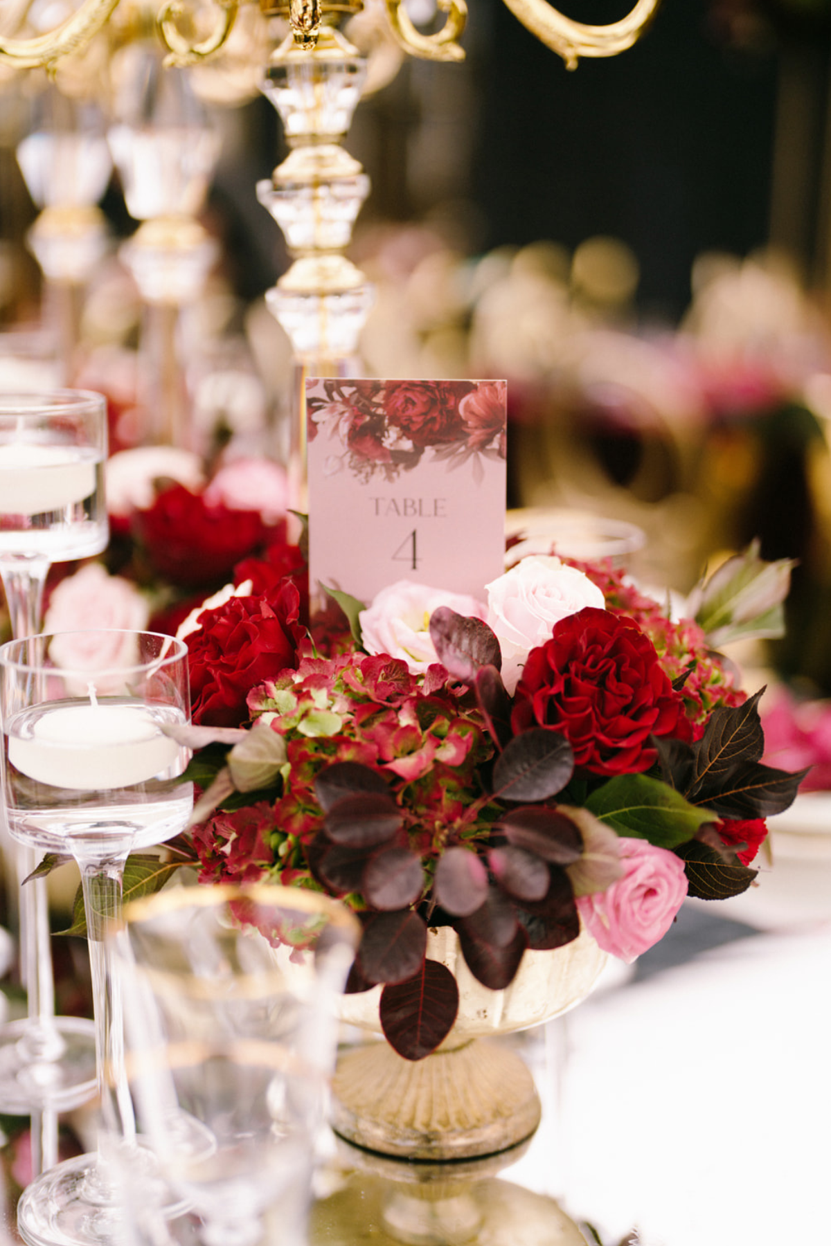 black-gold-burgundy-red-tent-reception-roses-centerpiece-stationery-table-number