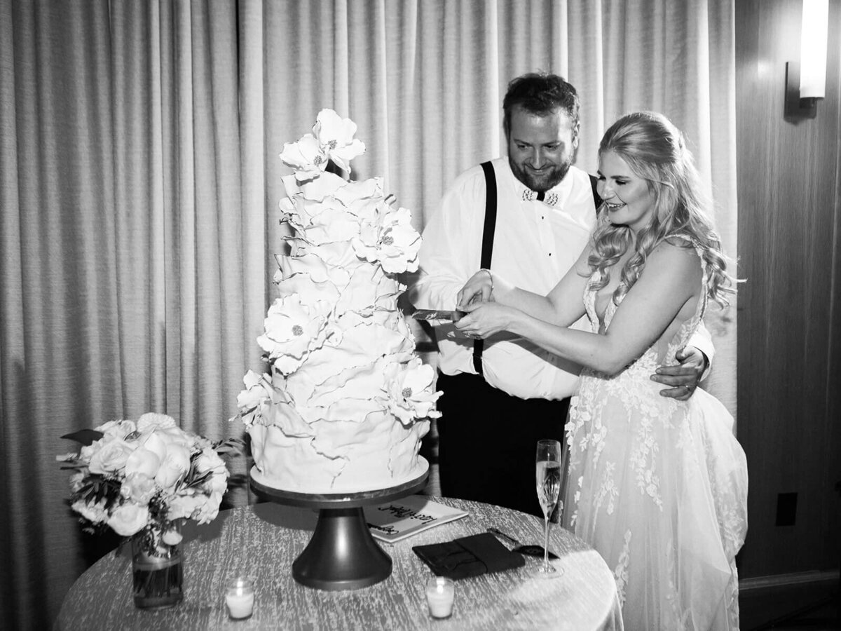 Bride and groom cutting a custom fairytale wedding cake