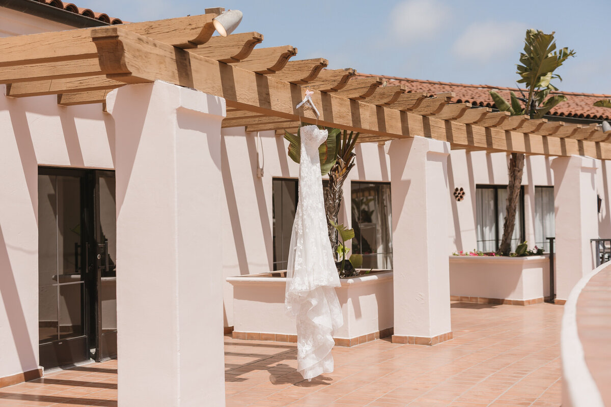 Wedding dress hanging outside at Hilton Beachfront Resort Santa Barbara