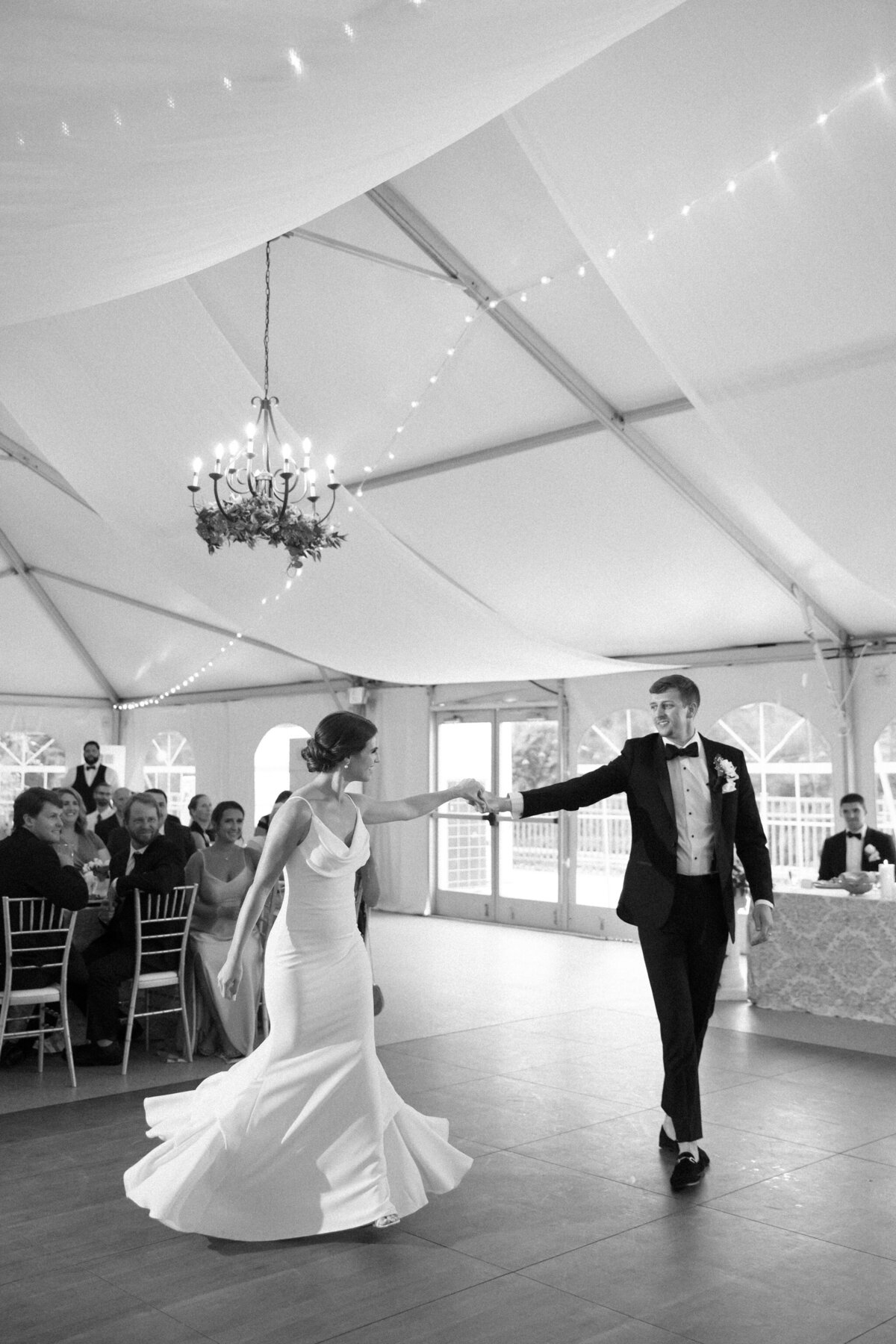 Black and white image of bride and groom sharing first dance at Rust Manor House