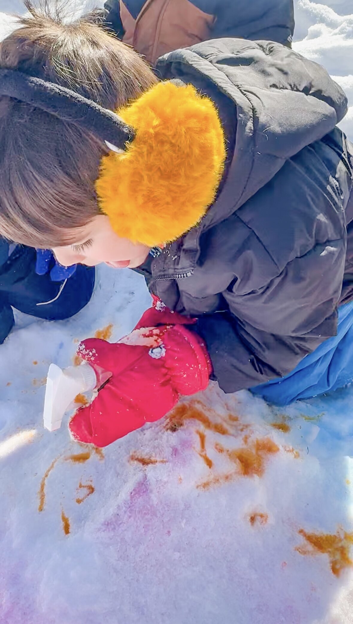 Children painting the snow at House of Parker preschool in Gorham Maine, where we protect and nurture imagination, giving children time and freedom to explore, invent, and lead their own play.