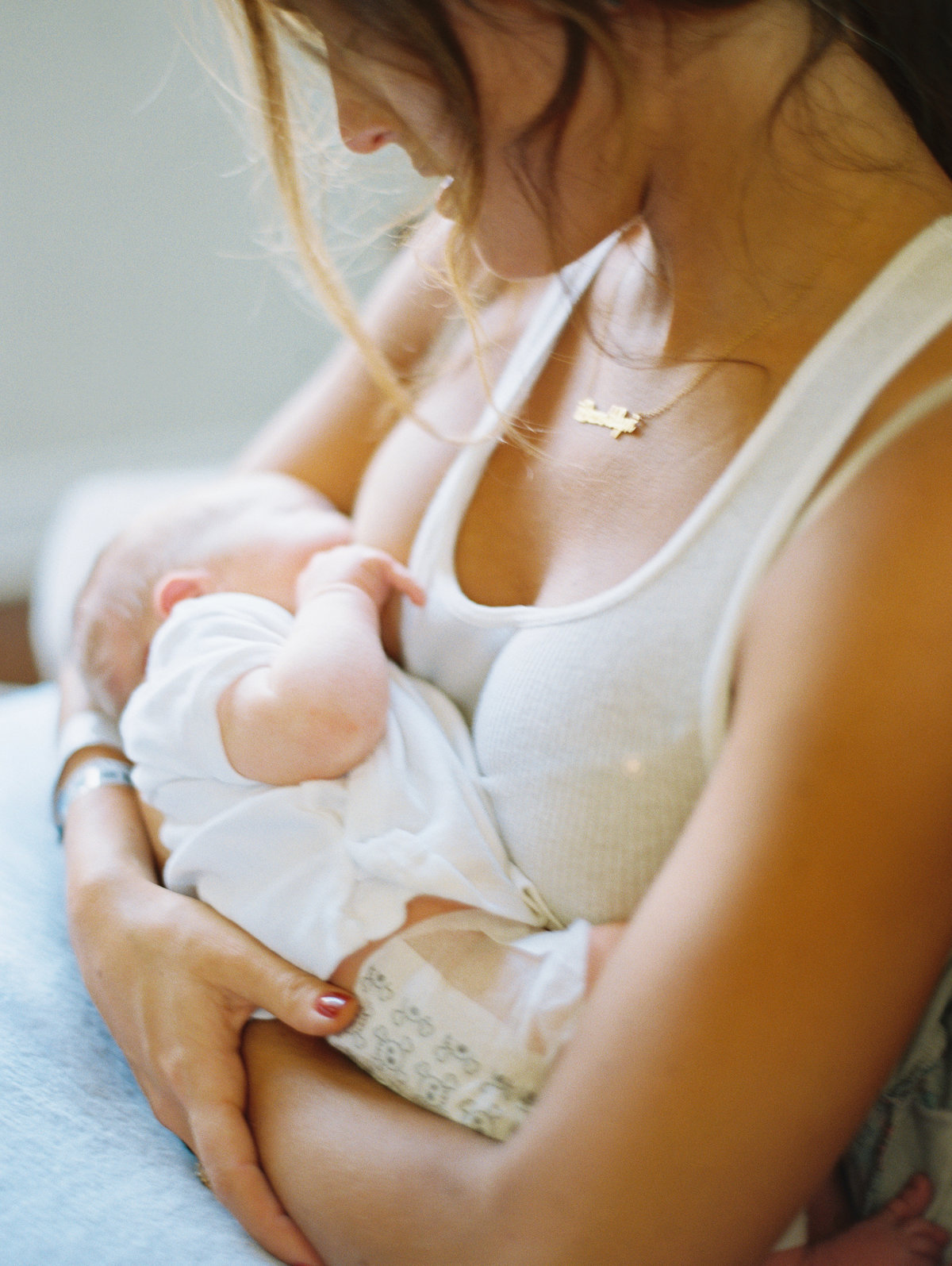 mother breastfeeding newborn baby