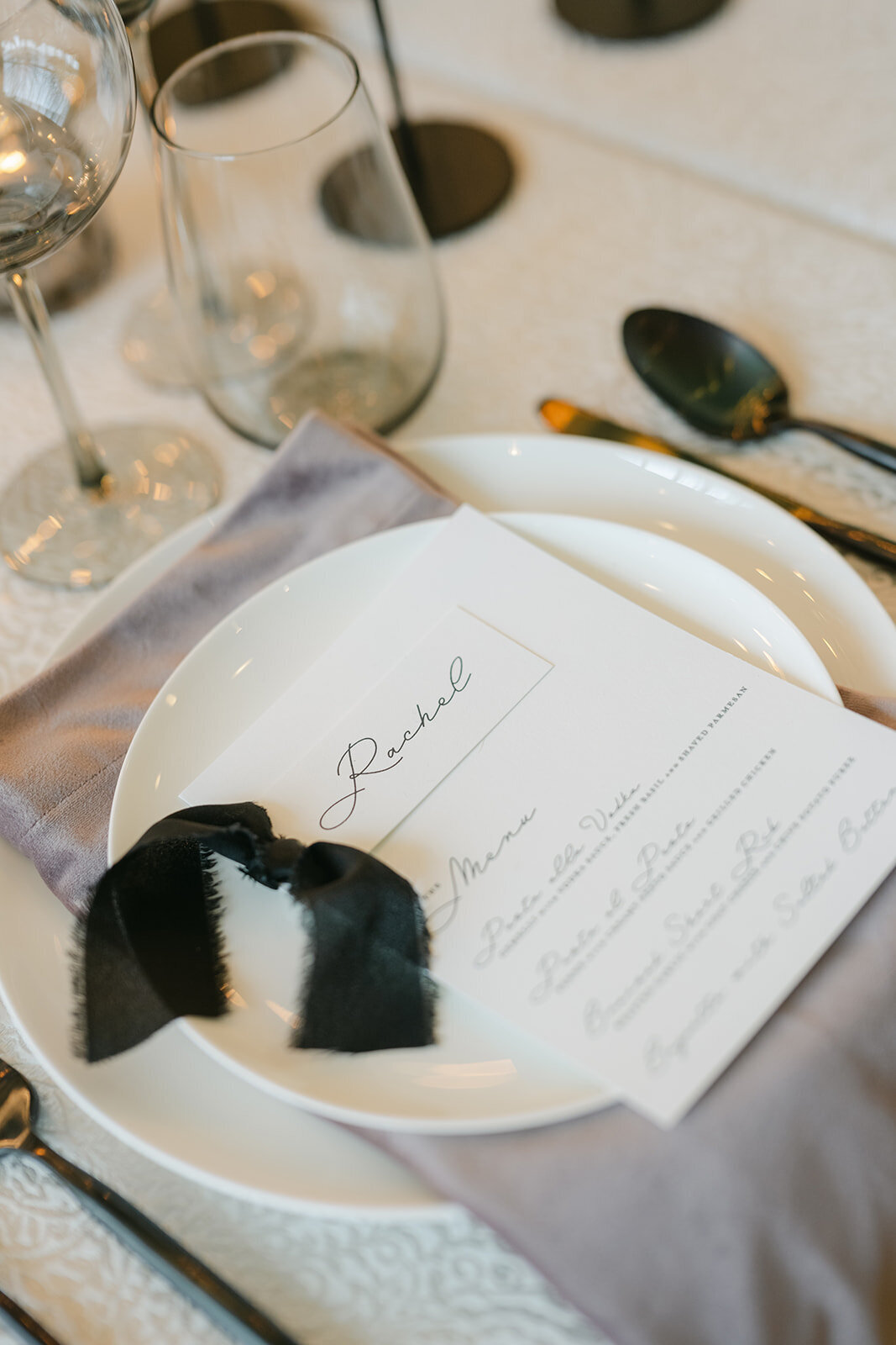 Modern and minimalist black and white menu and placecard with hand-tied ribbon for 2025 Winter Prospect House Sip and See 