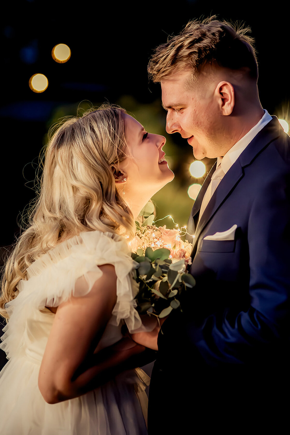 bride and groom caressing