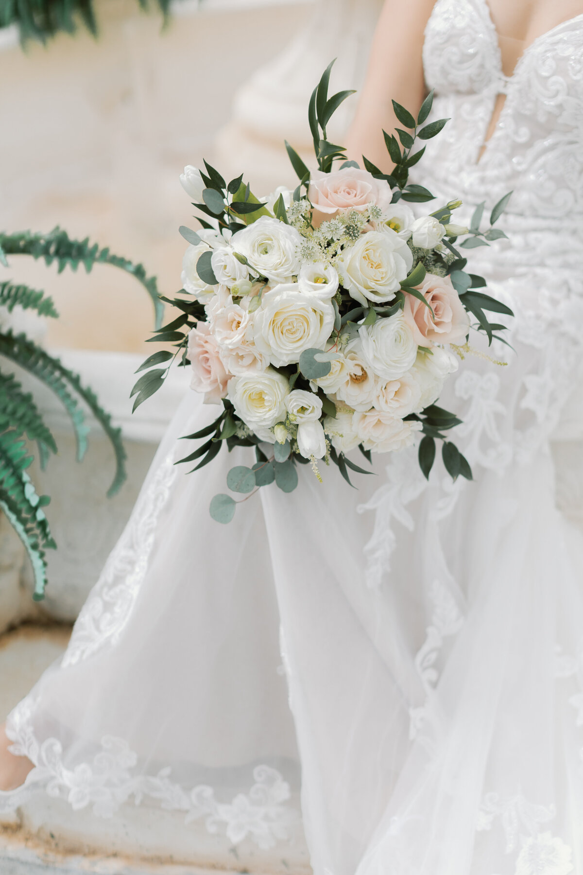 White and blush bouquet of roses and eucalyptus created by Flowers by Wendy Carol