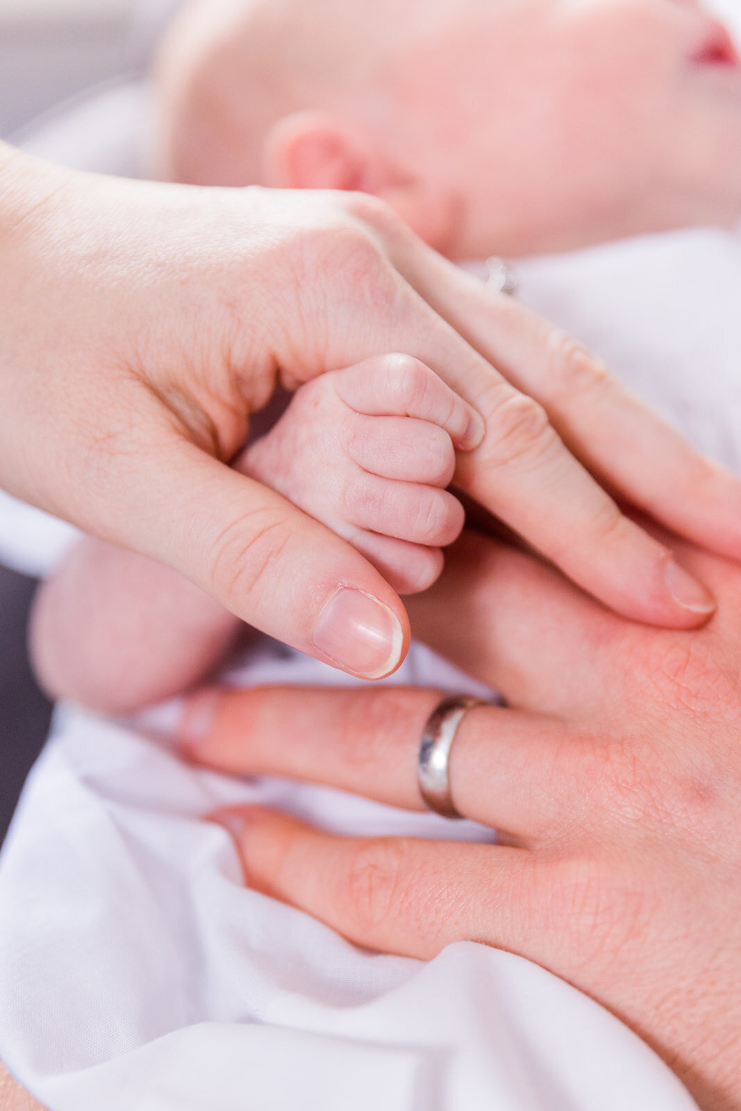 hand detail close up of parents and newborn hands together Laure Photography Atlanta family and newborn photographer