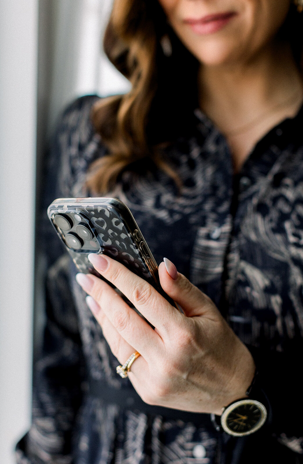Womans hand holding iphone