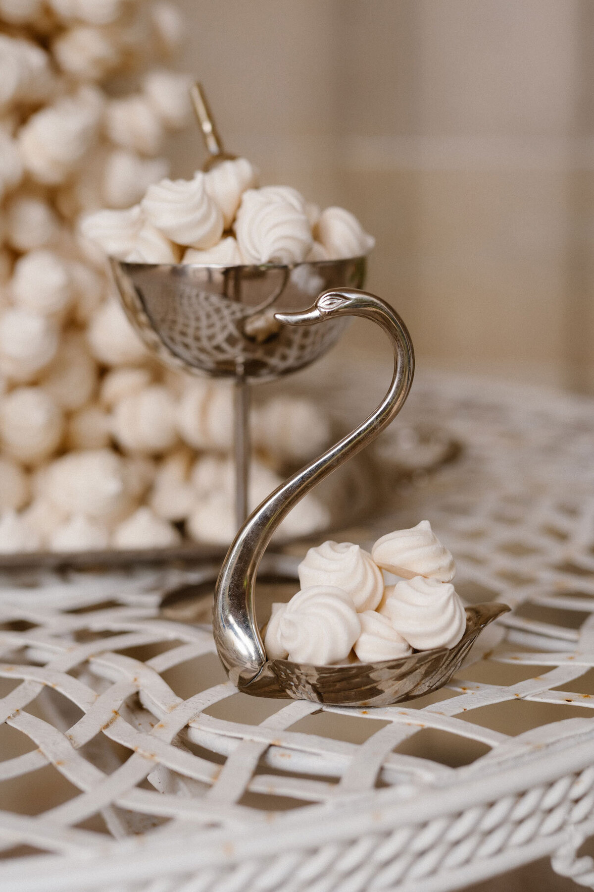 Elegant wedding dessert alternative — crisp meringue tower at a classic château celebration