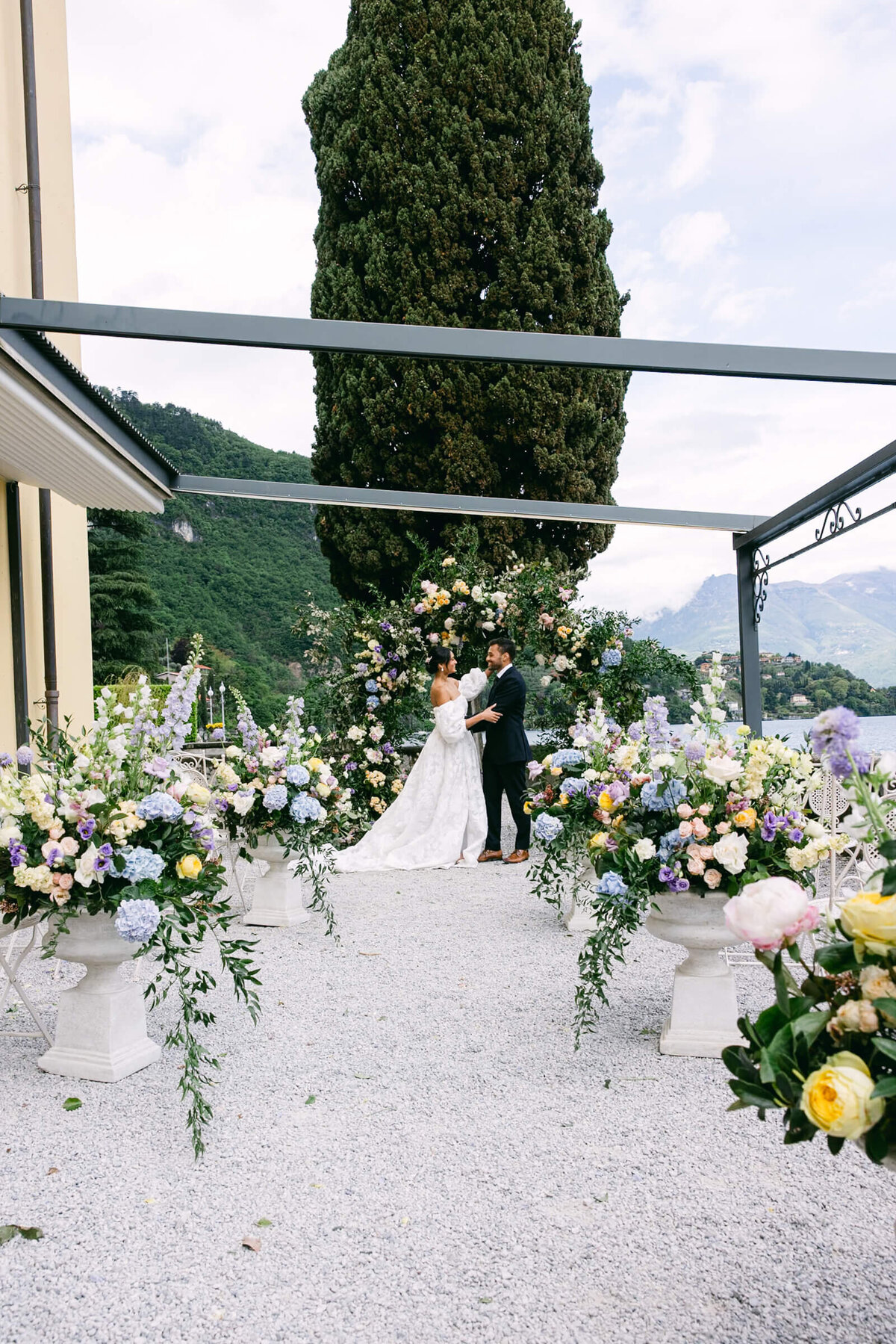 A wedding day photo of the bride and groom at Villa Aura del Lago on Lake Como in Italy