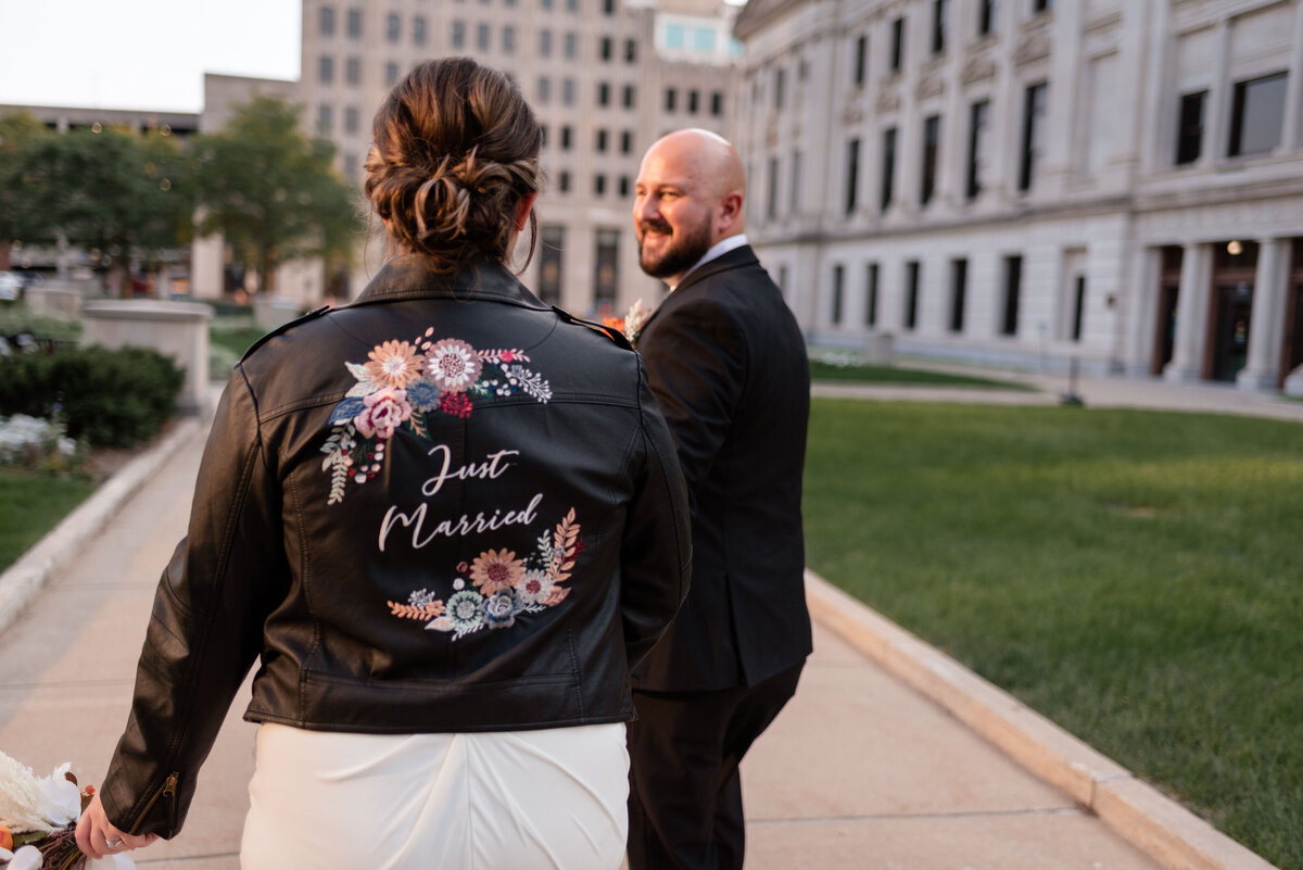 just married wedding photo jacket bride and groom photographer