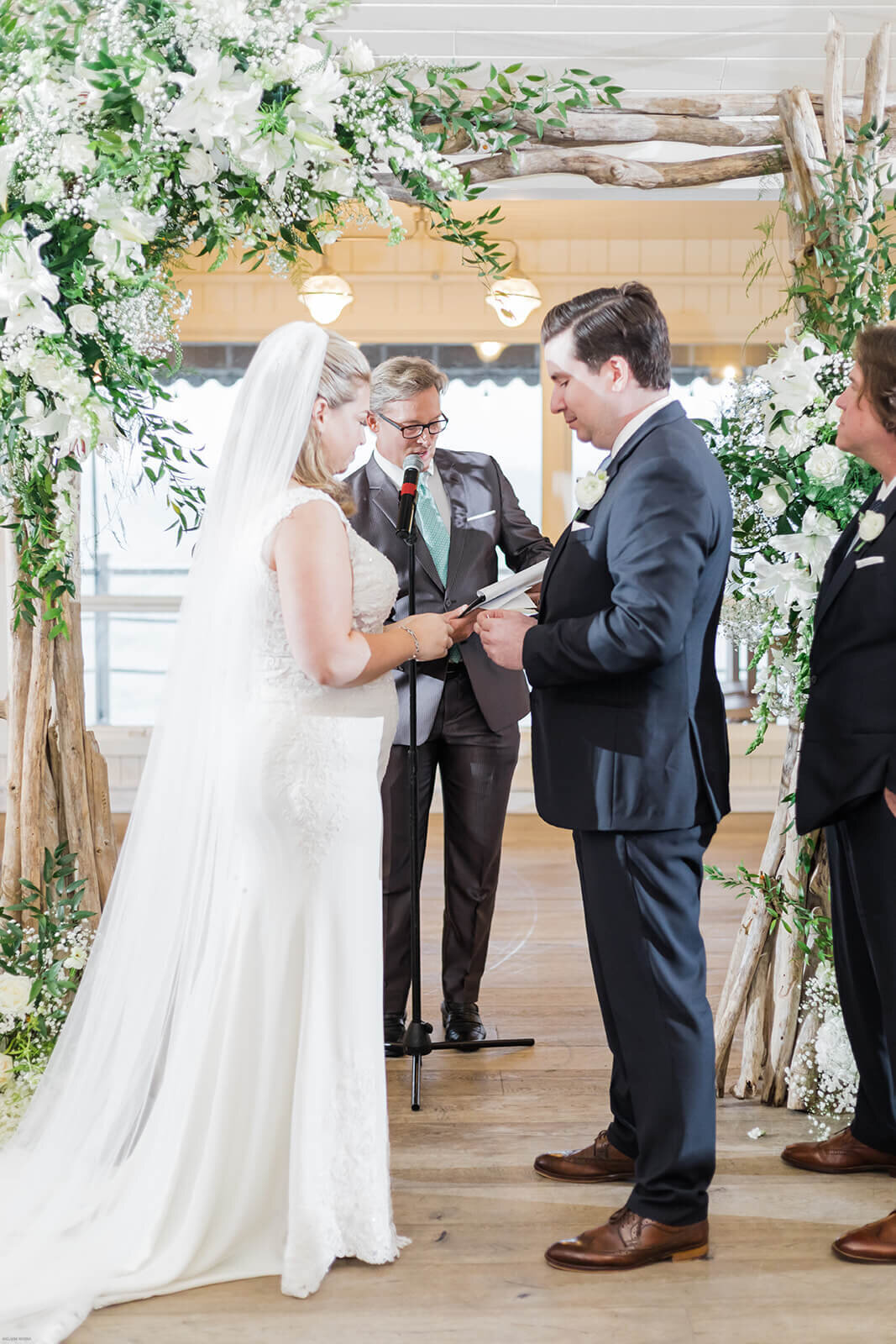 Bride and groom exchanging vows at Long Island wedding