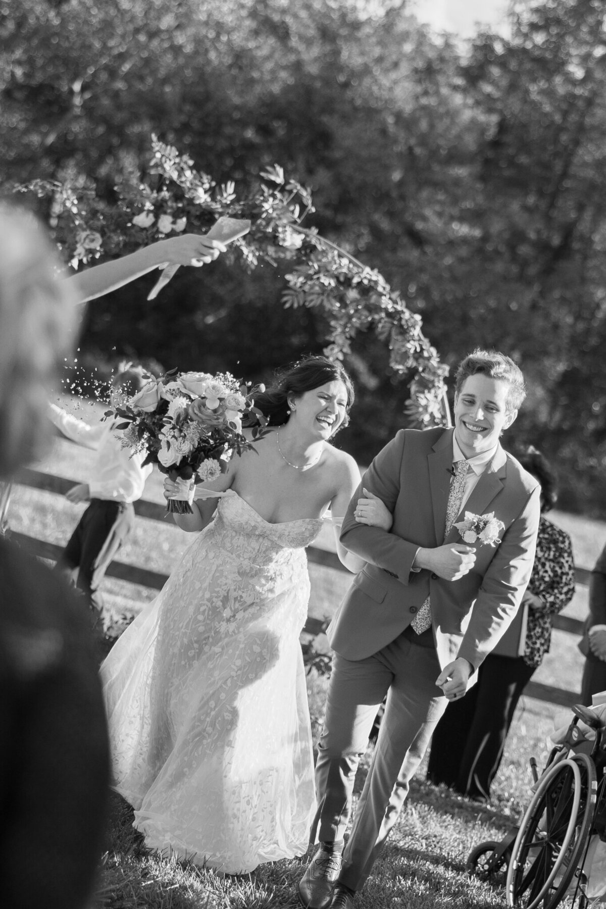 A newly-wed couple walking back down the isle after the first kiss.