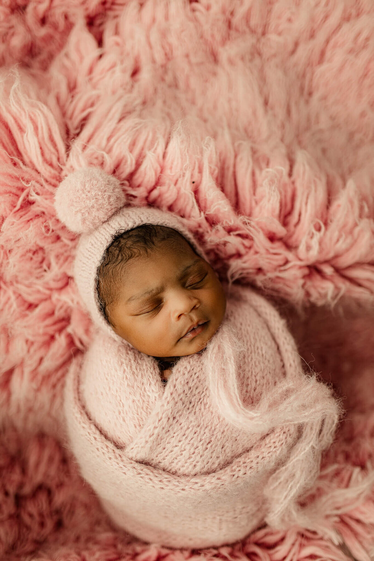 baby swaddled in pink in Atlanta studio