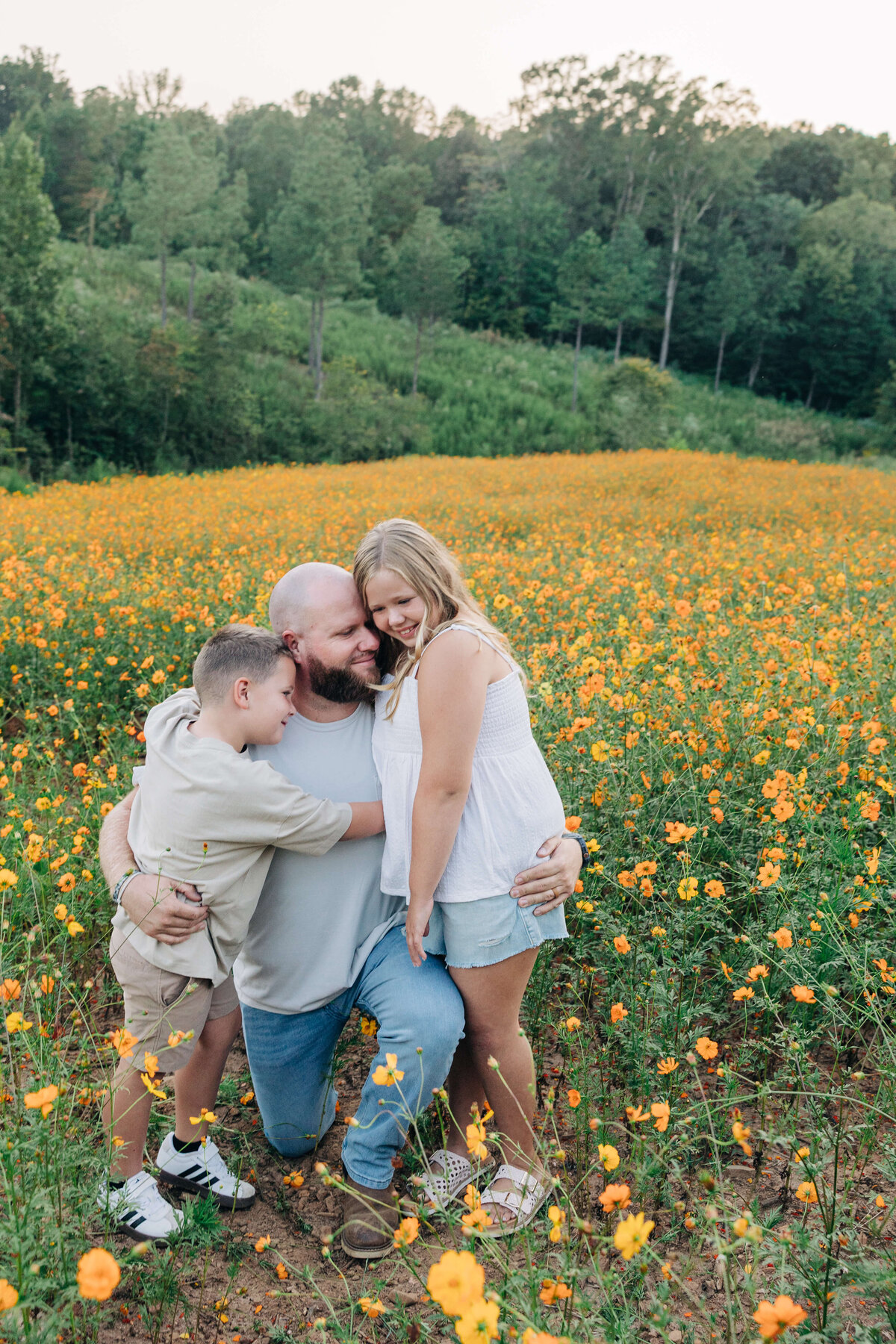 Kids-hugging-dad-Dogwood-Farm