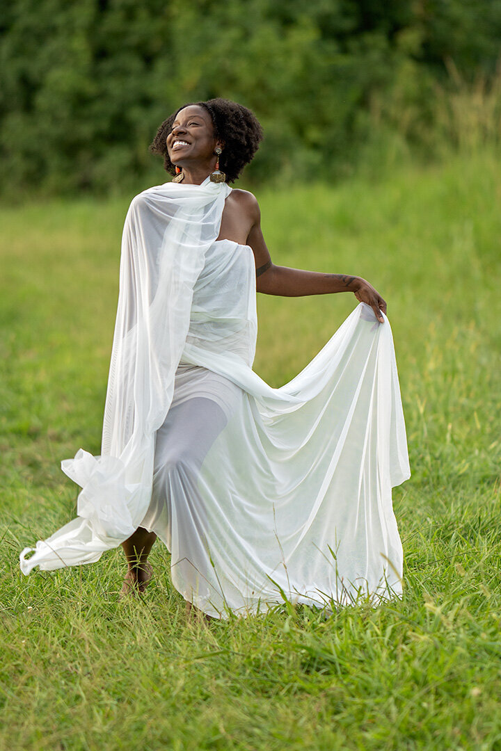 Black Female Smiling White Dress Grass Field Portrait