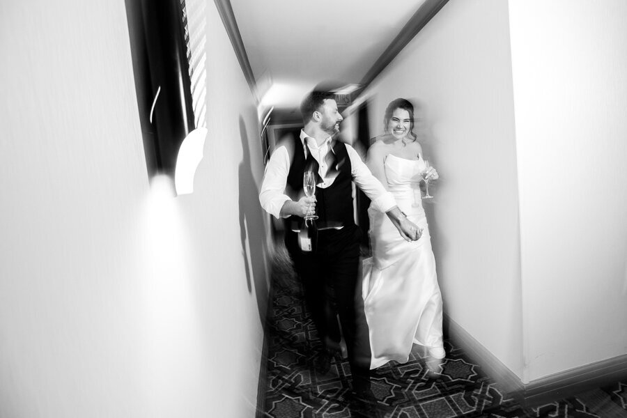 Newlyweds-intercon-hotel-chicago-hallway-fun-HBICWeddings