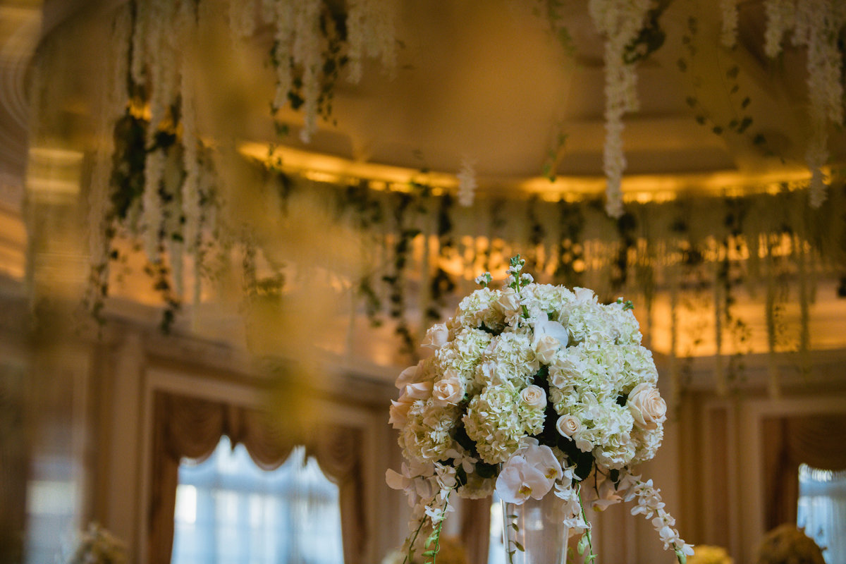 photo of reception ceiling and flowers at The Muttontown Club wedding venue
