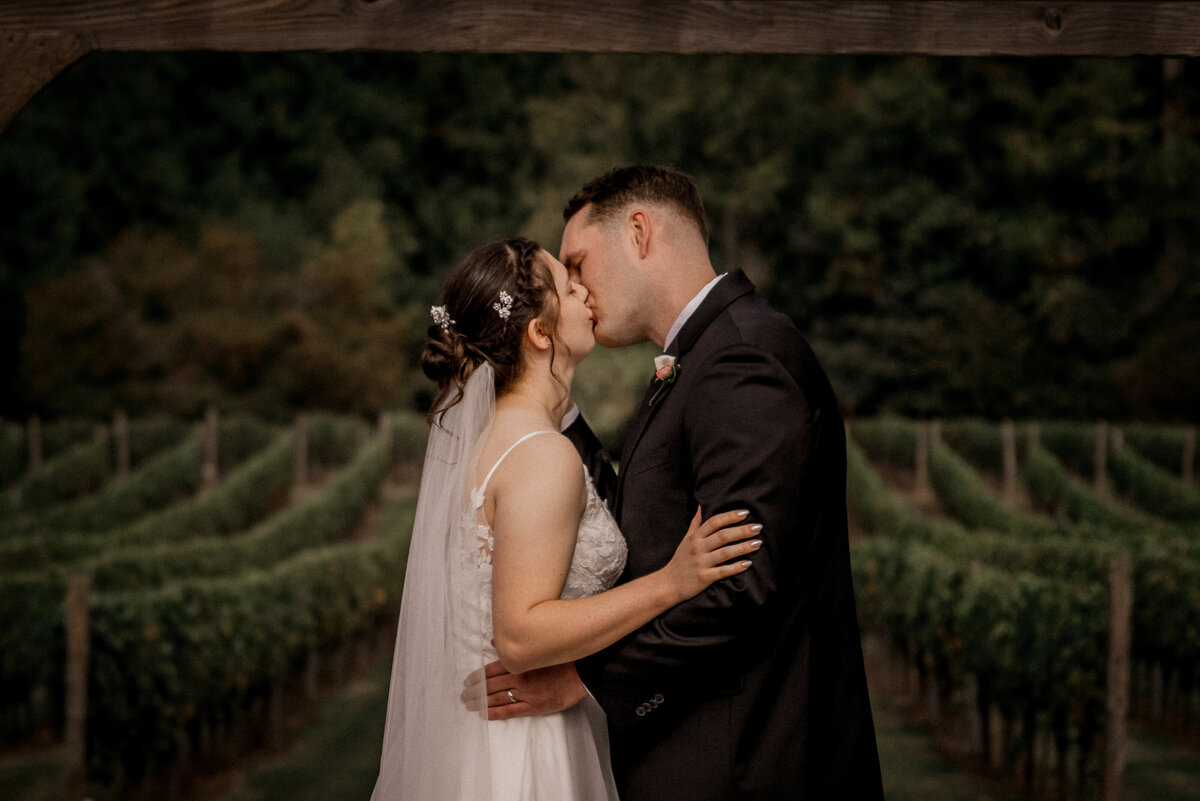 Couple kissing at altar Ridgefield WA wedding photographer