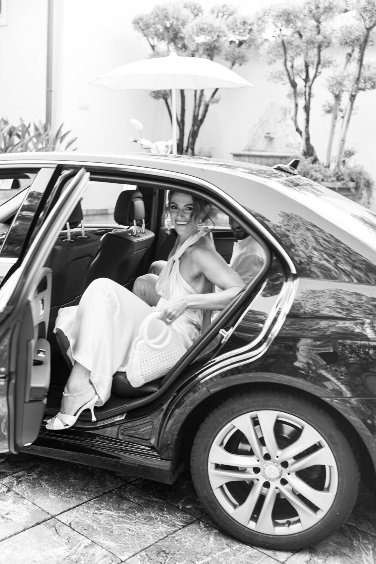Bride posing inside the car