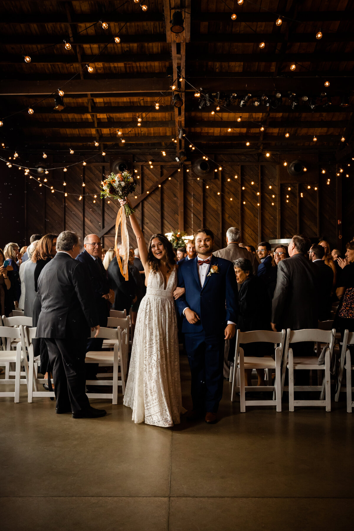 Bride and Groom cheer after wedding at Saltwater Farm Vineyard.
