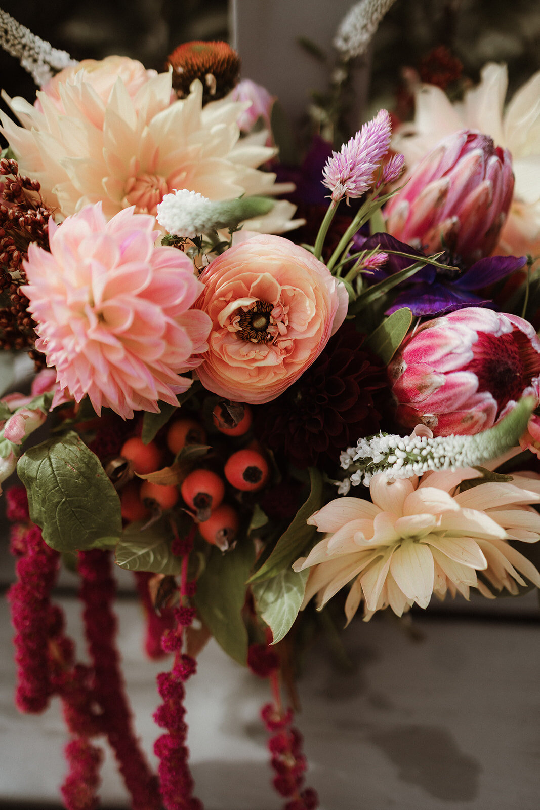 Moody fall bridal bouquet with dahlias and rich tones at a Hudson Valley winery wedding