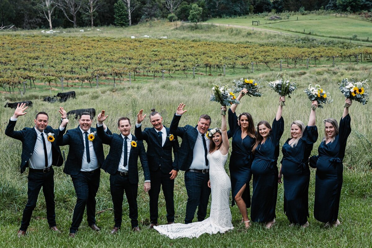 Kara & Ben together with their bridesmaids and groomsmen having a fun photoshoot!