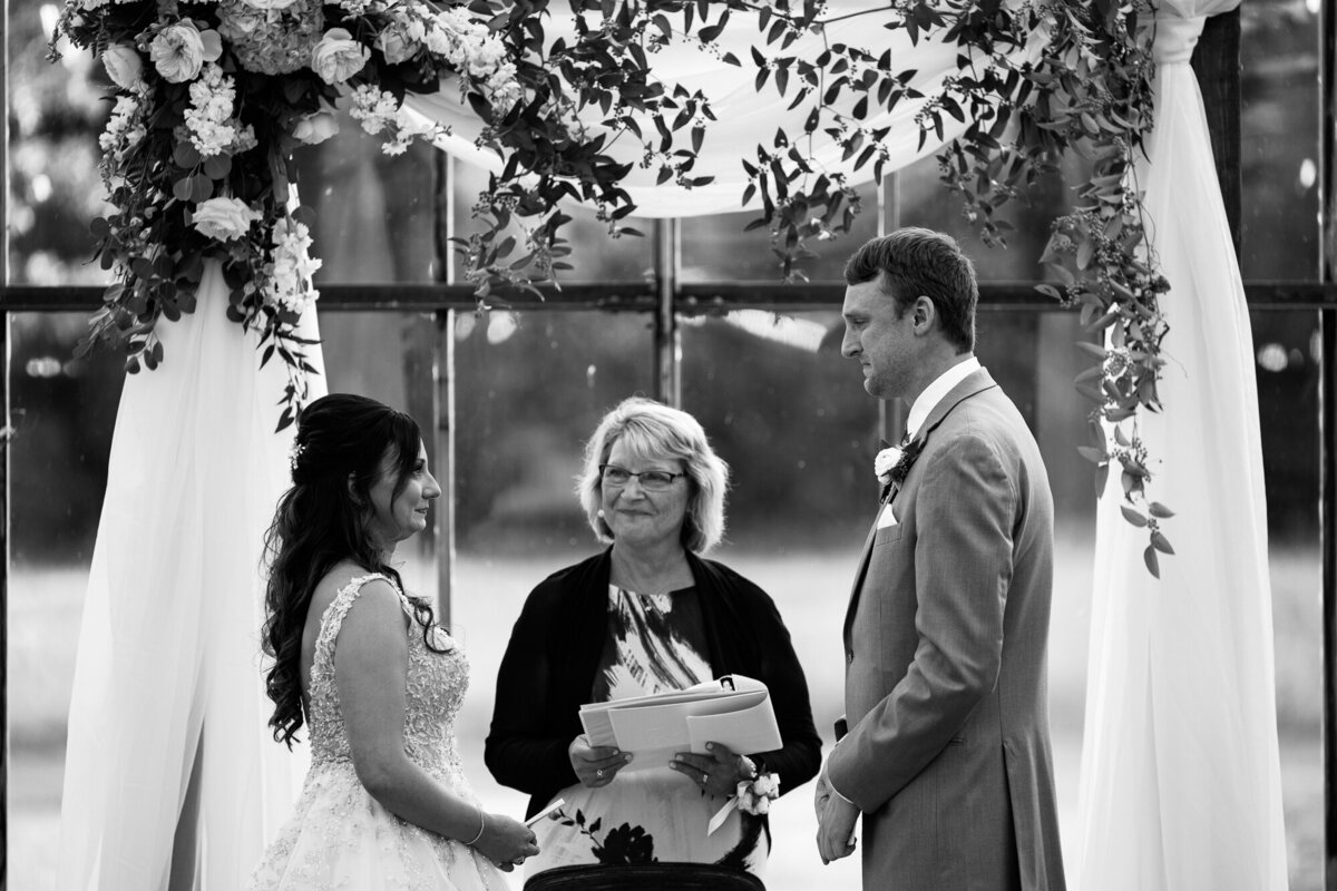Bride and groom share vows during wedding ceremony