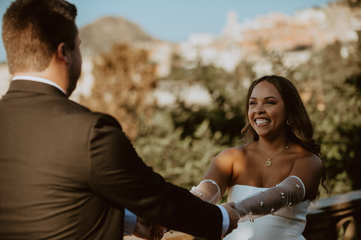 couple laughs in taormina italy 