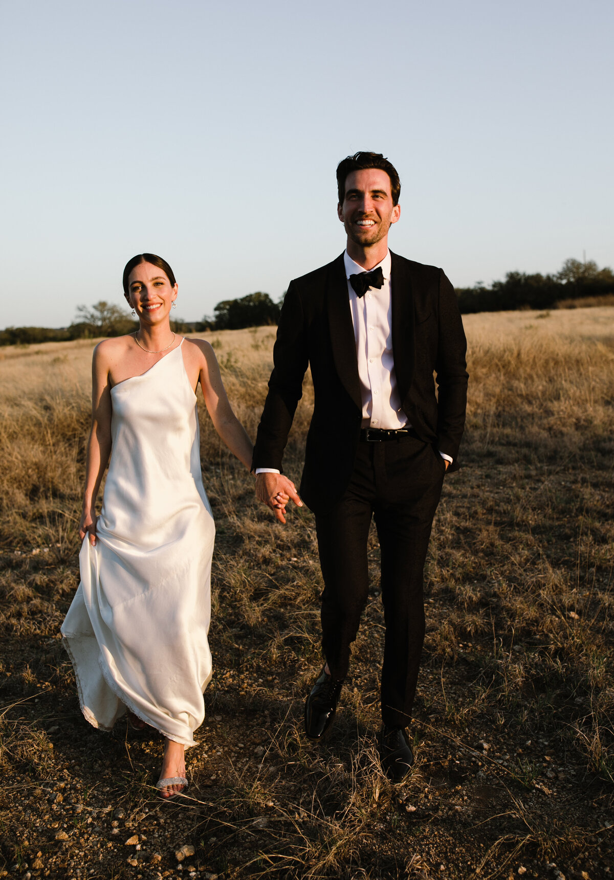 Bride and groom portraits in a field for Austin wedding