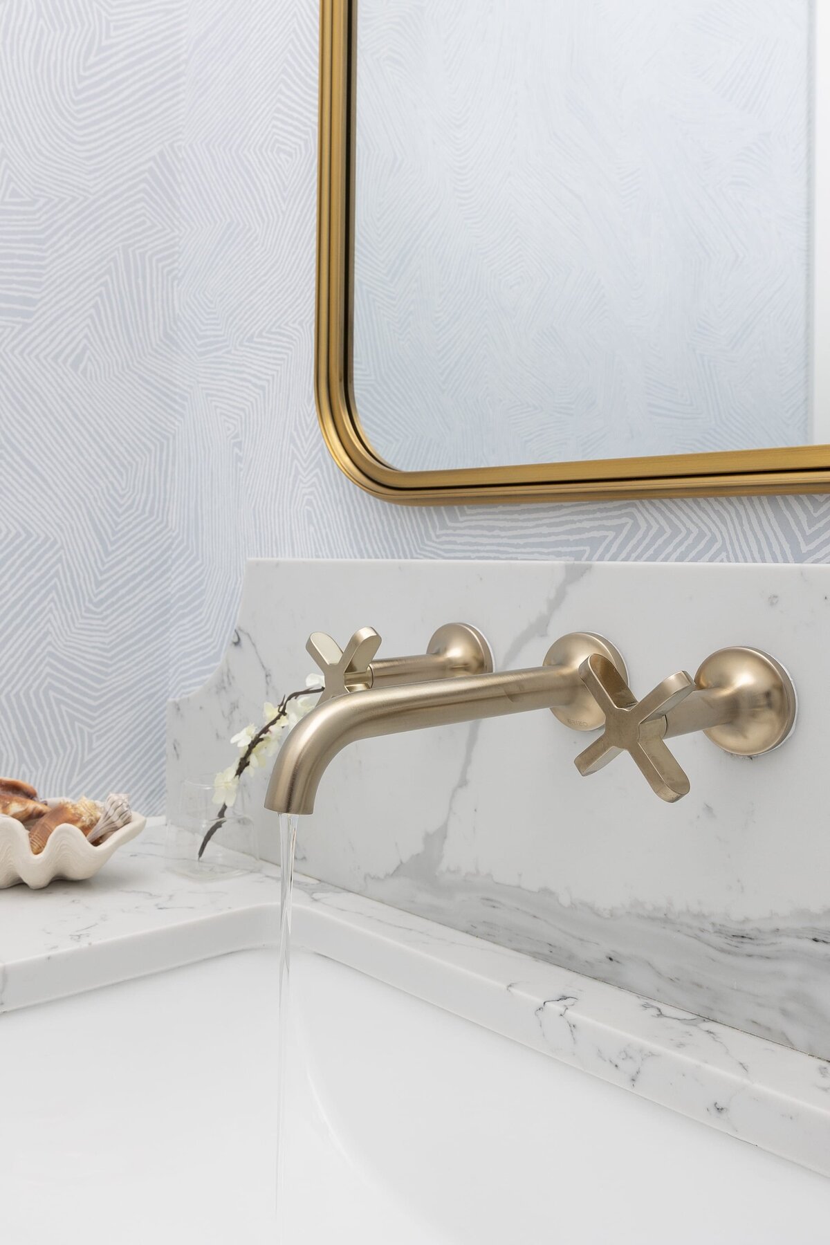 dewine design orlando interior designer contemporary coastal powder bathroom gold framed mirror with faucet