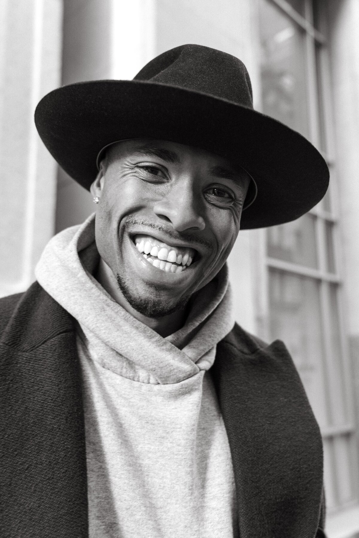 Natural light portrait of a person smiling in a casual setting