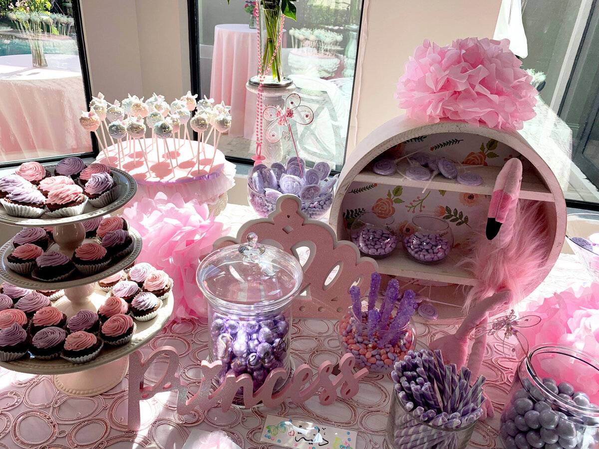 Adorable pink-themed baby shower tablescape featuring elegant décor and a charming flamingo centerpiece, creating a whimsical and joyful celebration, designed by In Full Bloom Event Planning & Design
