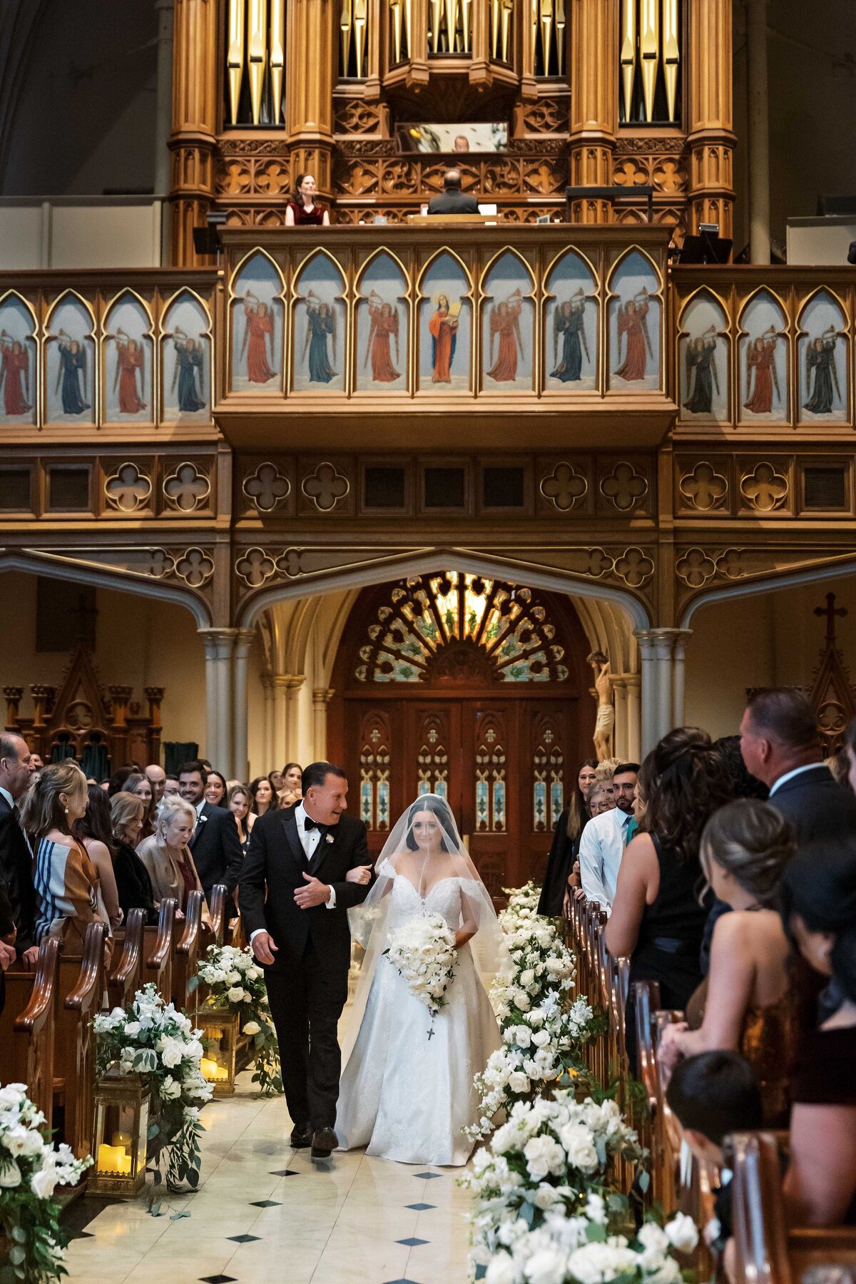 bride walking down aisle at St. Patrick's Catholic Church