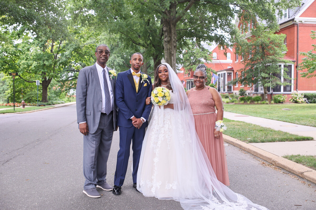 black bride and groom standing with grandparents by Washington DC wedding photographer Amanda Richardson Photography