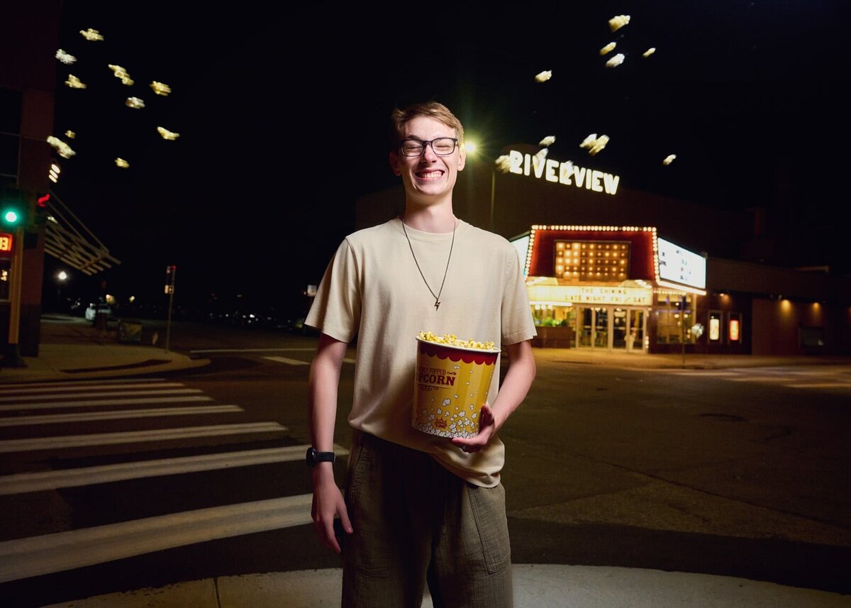 Joyful Senior Picture Photographer at Night With Popcorn in Hand-51