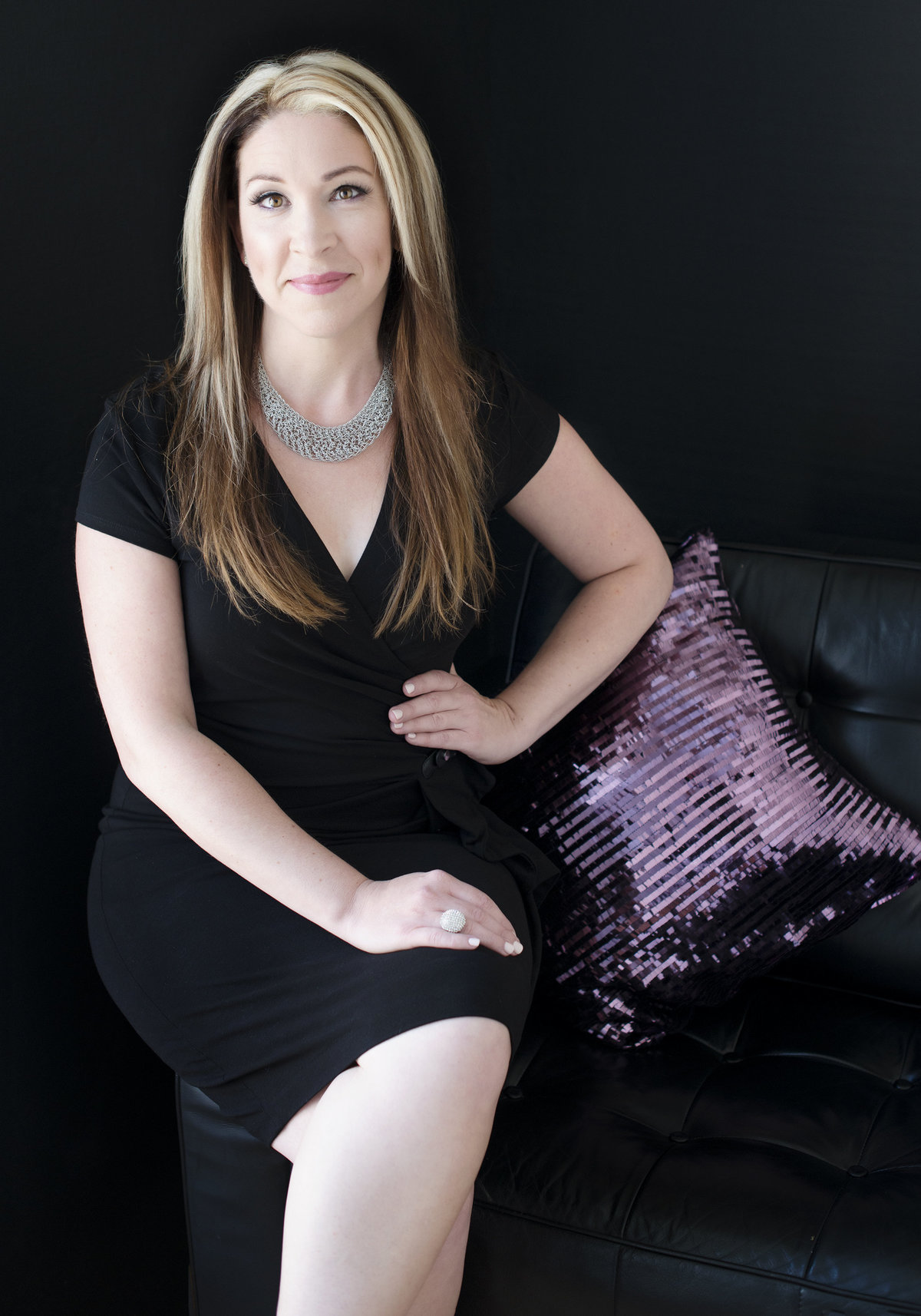 powerful corporate  portrait of  woman wearing a black dress leadership, charw , warm and  confident
