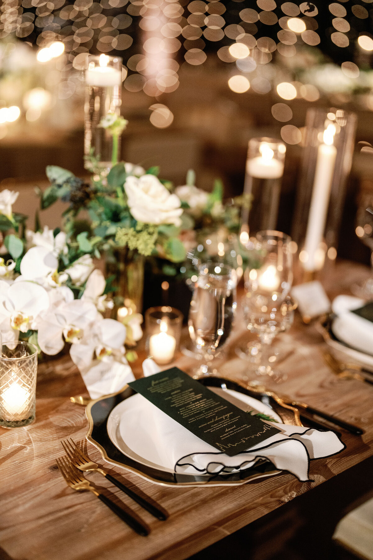 Elegant Table Setting with Candlelight and Floral Details