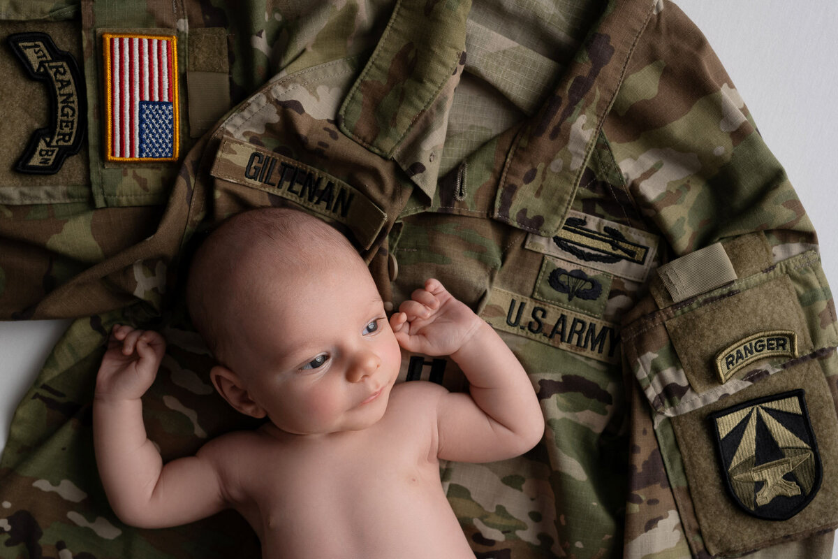 Newborn baby military uniform prop Lago Vista professional photographer