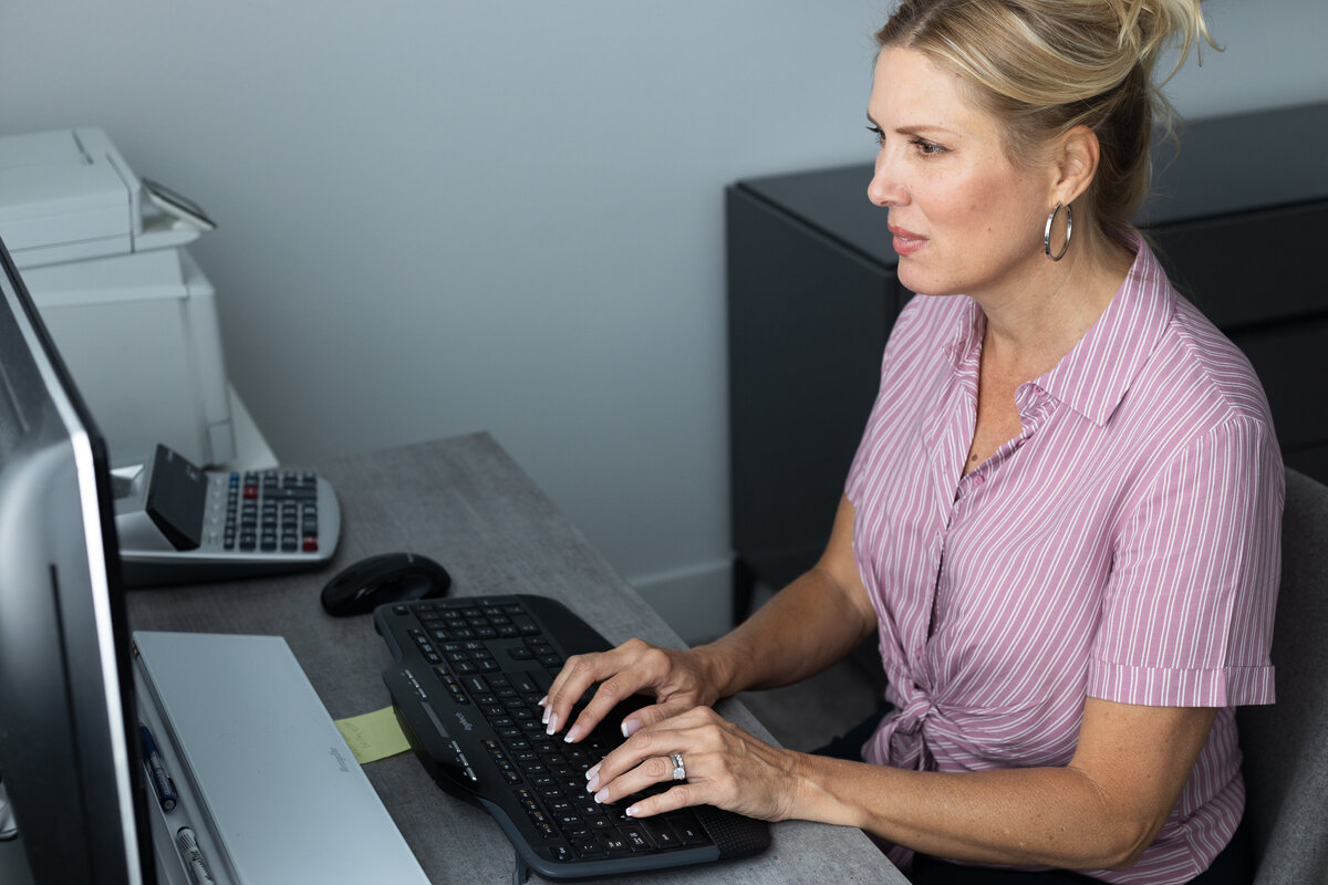 Accountant at desk working on her computer