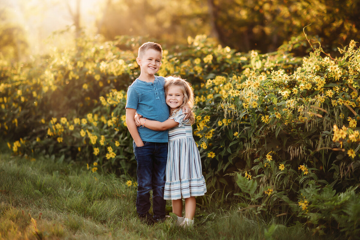 Siblings hug during Family Photos in Asheville, NC.