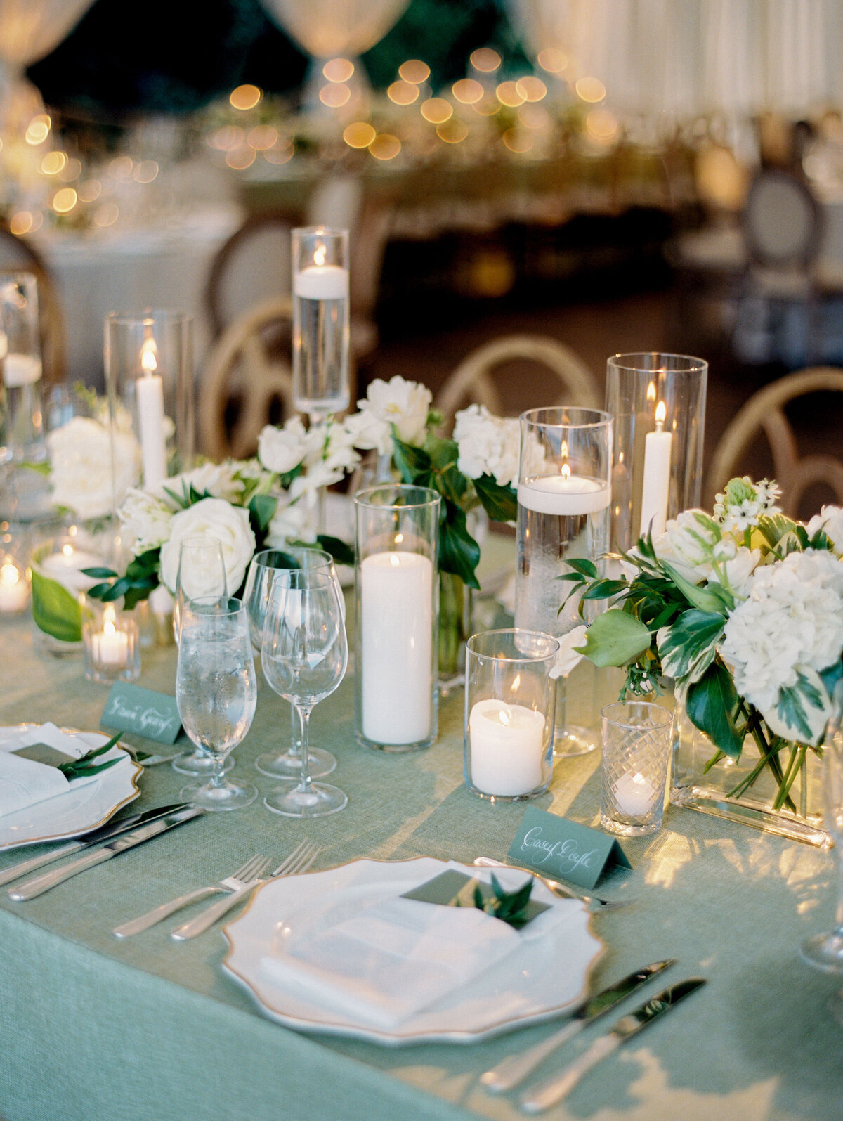 Close up of a table setting surrounded by candles and flowers at the Shoresacres CC.  
