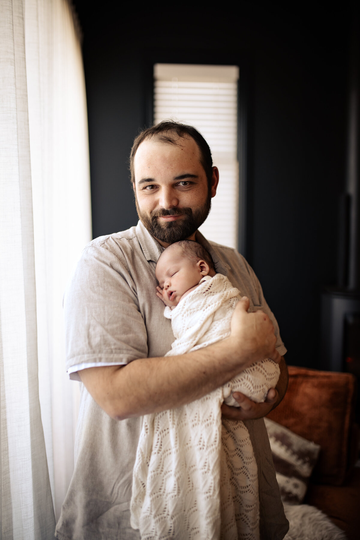 Newborn baby yawning peacefully in a cozy Hawke’s Bay home – heartwarming newborn photography by a local Hawke’s Bay photographer, capturing tender moments in Napier, Hastings, and Havelock North